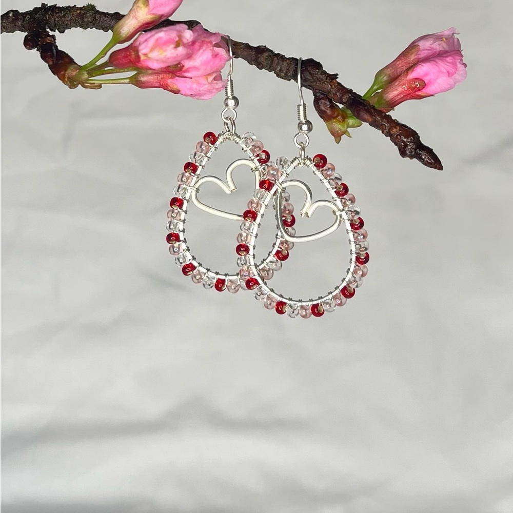 Silver toned wire wrapped heart dangle earrings